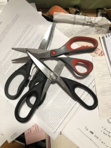 Three pair of scissors in a pile.