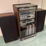 A stereo cabinet with record player and speakers sit in a Silver Spring home.