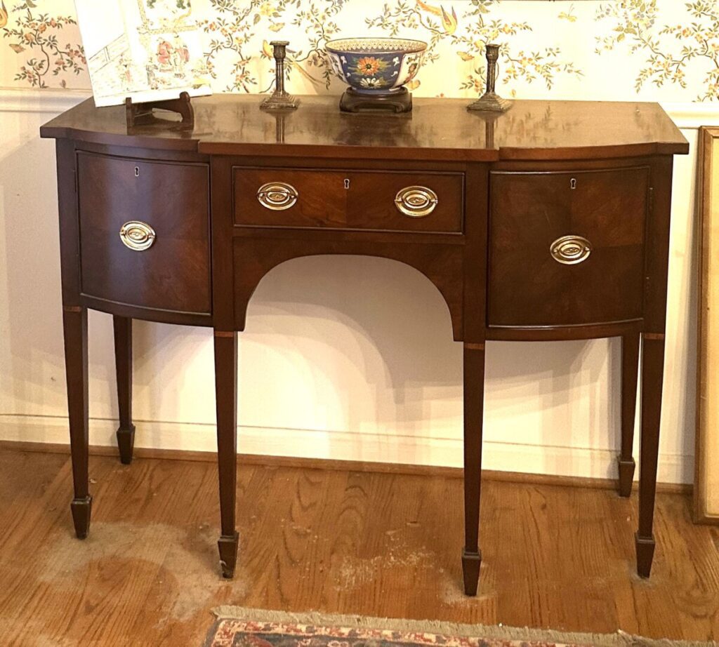 What's my antique buffet worth? This Hepplewhite-style buffet/antique buffet is pretty but it's only worth $100 to $150 at auction.