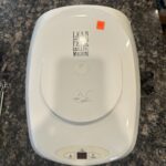 The top of used, white George Foreman grill priced at $8.