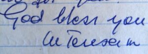 Mother Teresa's signed name on a handwritten letter.