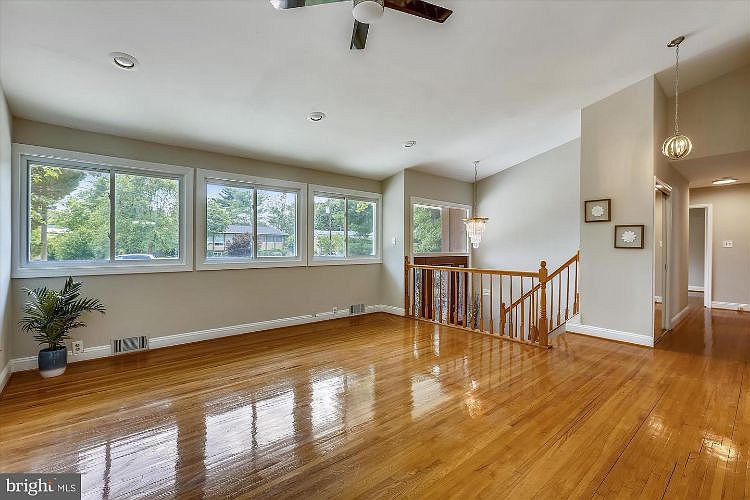 Estate liquidation videos like ours show what you need to know to get your house empty and sparkling -- like this living room with big windows and hardwood floors.