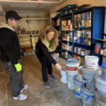 Raea Leinster inspecting paint and chemicals during household hazardous waste removal in Montgomery County
