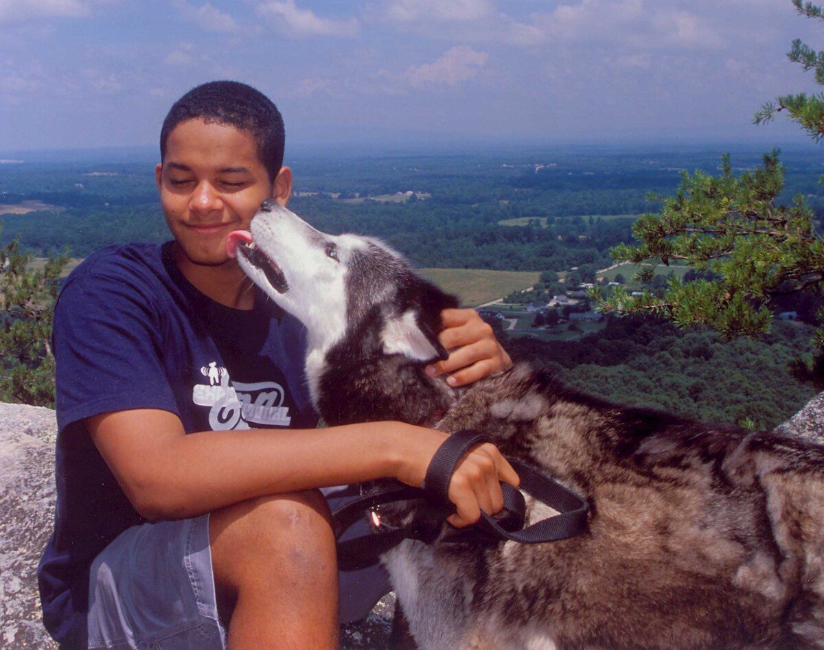 siberian husky orion licking face family photo shelter dog inspiring estate cleanout donation to animal shelter