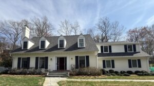 Potomac moving services project home exterior—large colonial-style house prepared for move, downsizing, and full cleanout by Orion’s Attic