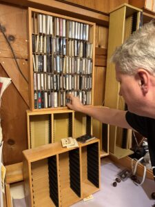 Chris from Orion's Attic combs through even cassette tapes looking for valuables for clients.