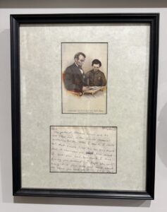 A postcard of Abaraham Lincoln and son framed with a note from my father